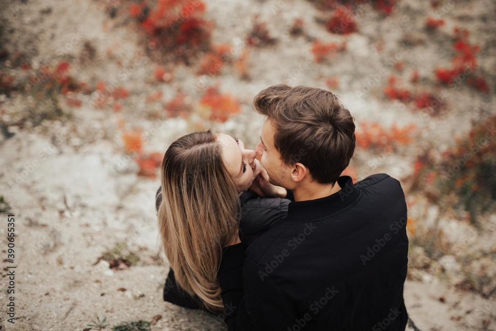 Close-up portrait of man and woman together looking at each other and smiling. Close-up portrait of man and woman together looking at each other and smiling.