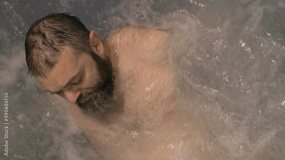 Man relaxing in jacuzzi top view Man relaxing in jacuzzi top view