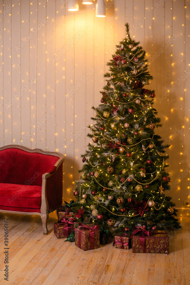 Large green Christmas tree in gold and red decorations