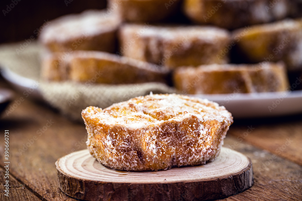 baked or fried bread with sugar and cinnamon. Dessert called Rabanada, Torrija or golden bread. cooking do Brasil, Portugal and Spain baked or fried bread with sugar and cinnamon. Dessert called Rabanada, Torrija or golden bread. cooking do Brasil, Portugal and Spain
