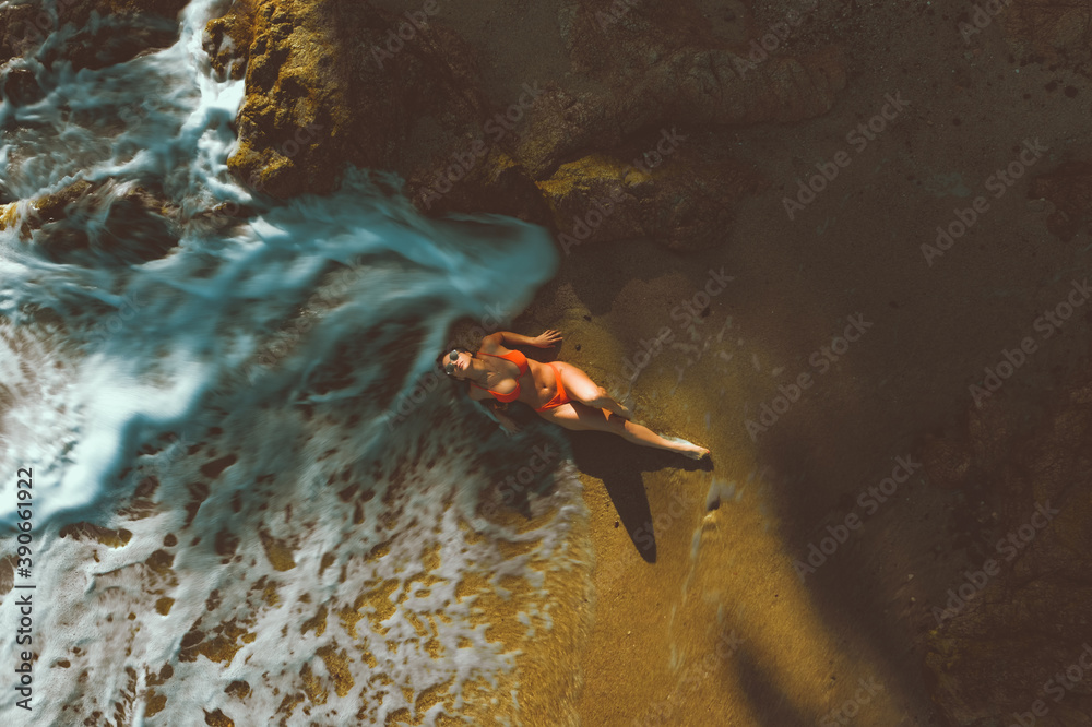 Woman on the beach taken with a drone Woman on the beach taken with a drone