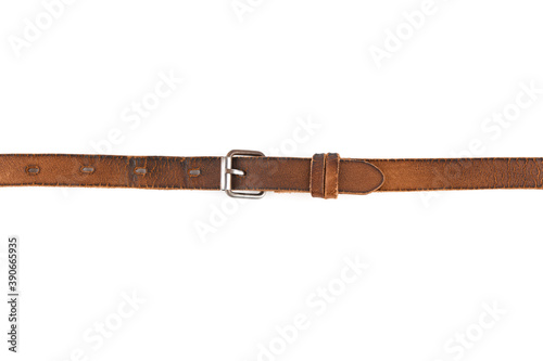 Old leather men's belt on a white background. Brown belt for men. Brown leather belt for trousers and jeans. Male accessory. Vintage things. 