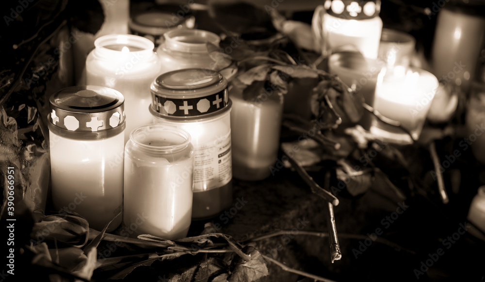 Hanau, Germany - February 20 2020: Flowers and Candles at the Hanau shooting site as a remembrance to the victims. Right extremism. Terror attack. Hanau, Germany - February 20 2020: Flowers and Candles at the Hanau shooting site as a remembrance to the victims. Right extremism. Terror attack.