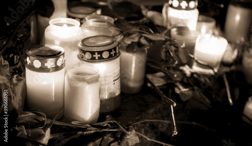 Hanau, Germany - February 20 2020: Flowers and Candles at the Hanau shooting site as a remembrance to the victims. Right extremism. Terror attack.