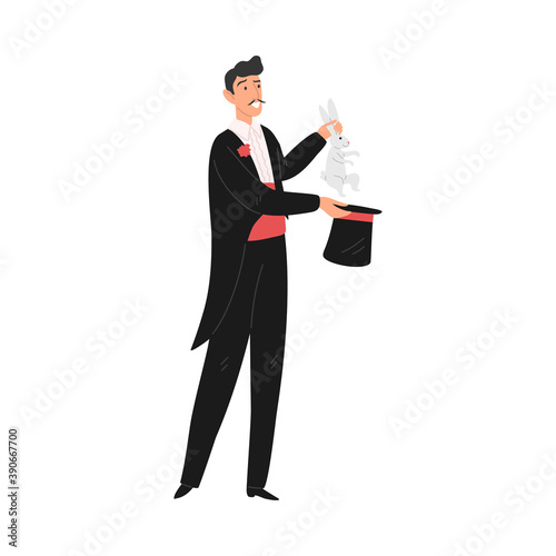 Smiling man magician showing tricks with rabbit and hat in circus