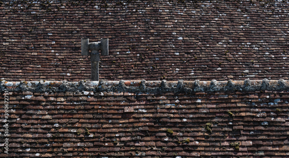 tiles pattern roof with vintage chimney