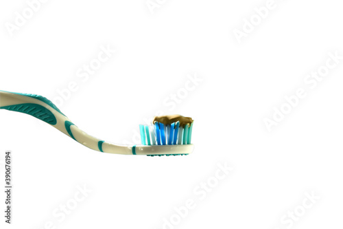 Toothbrush with toothpaste in a white background. 