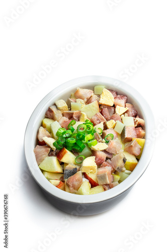 Herring salad with apple and potato isolated on white