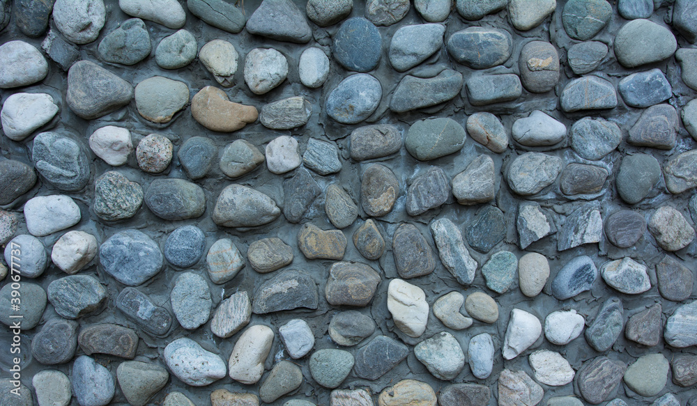 texture of a wall from round sea stones. texture of a wall from round sea stones.