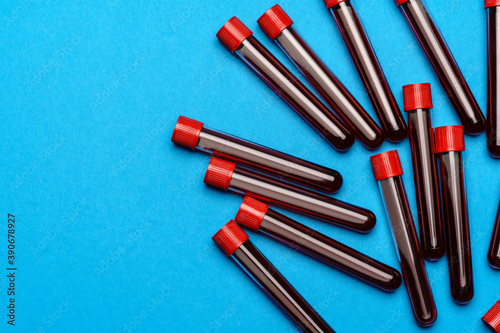 top view of medicine test tubes with blood samples over blue background top view of medicine test tubes with blood samples over blue background
