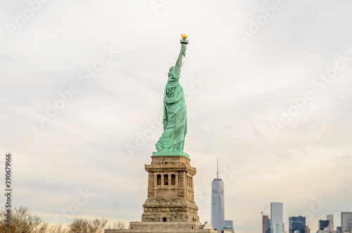 Lady Liberty Statue with Lower Manhattan Futuristic Buildings and Towers in  Background . New York City, USA