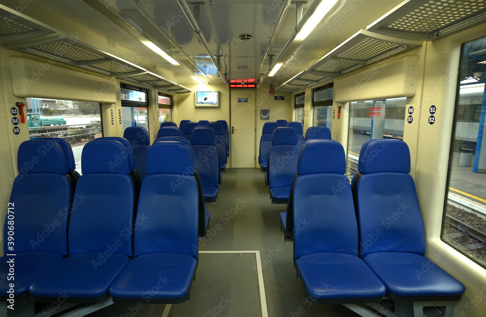 Naklejka premium Empty 2 class compartment of wagon of commuter train, seats and doors