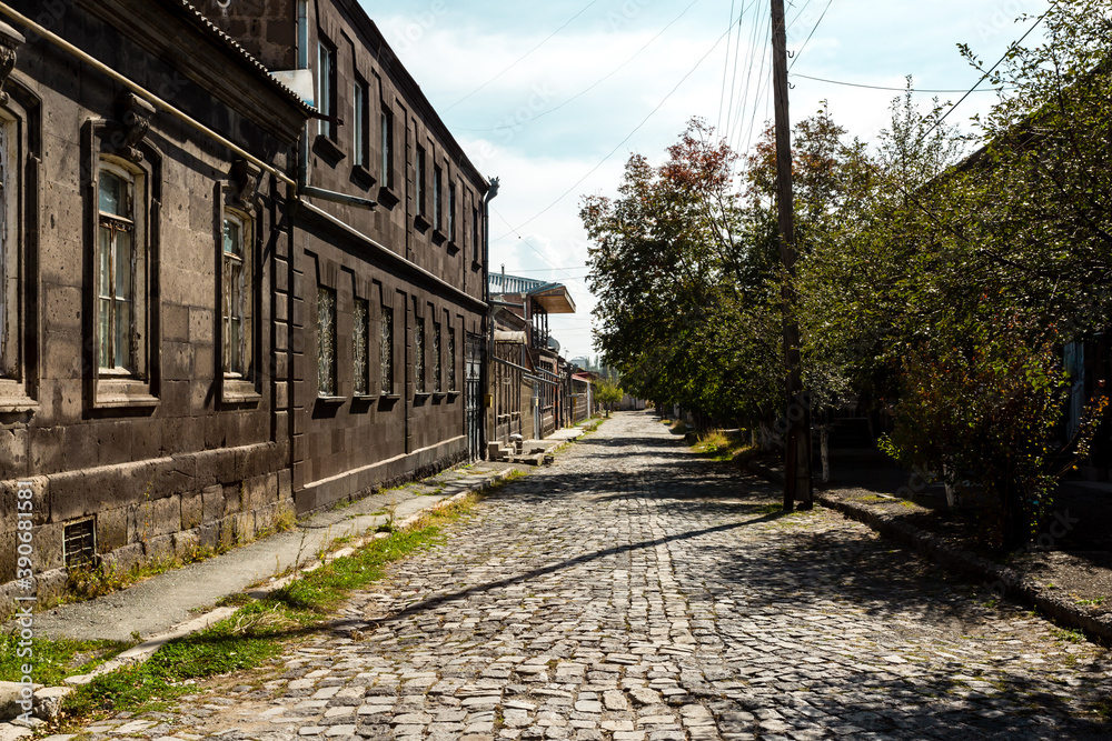 Old street with wooden houses and stone road in Gyumri, Armenia