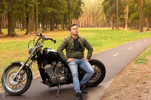 Beautiful young man, road, motorcycle