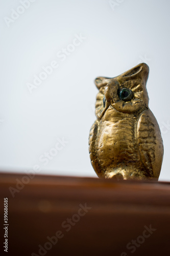 Golden owl for decoration at home with a white background 
