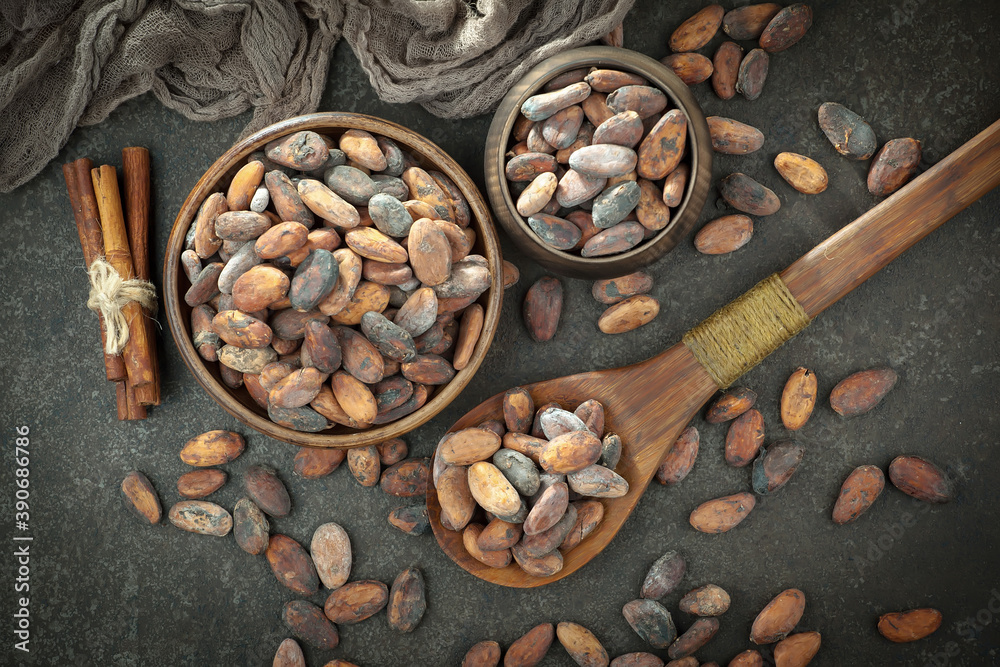 Cocoa beans on old background