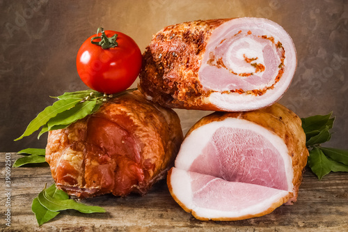 Obraz na płótnie A variety of meat products including pork, beef and fresh vegetables on a old wooden table and dark painted background w salonie