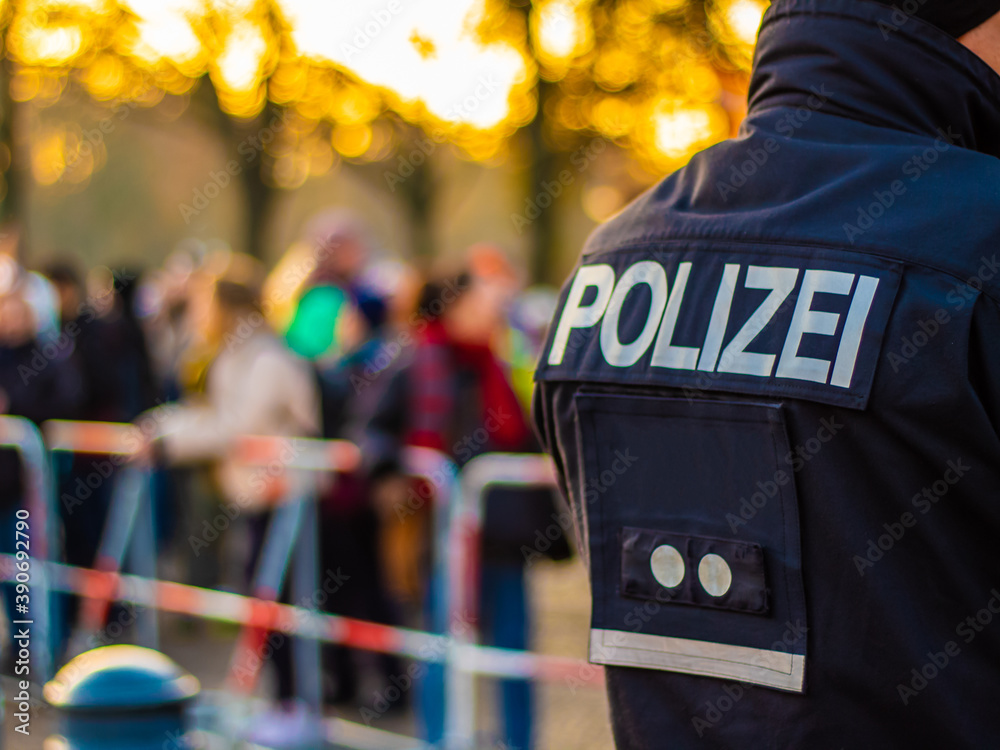 A police officer secures a demonstration in Berlin