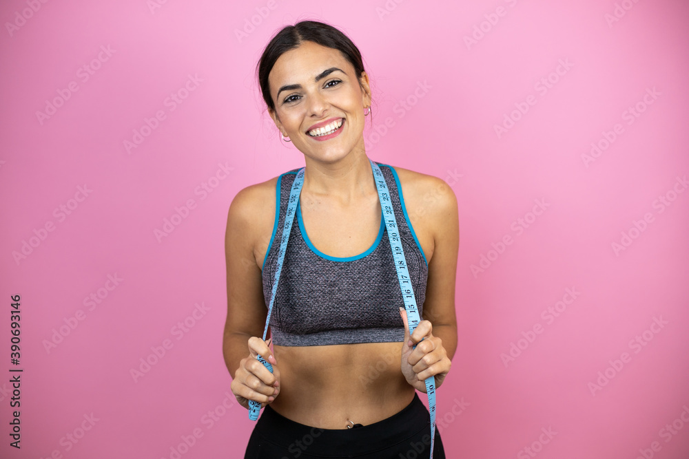 Fotografia do Stock: Young woman smiling confident wearing sports
