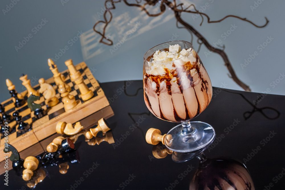 Chocolate and coffee frappe with whipped cream and syrup in the style of Alice in Wonderland with chess and reflections