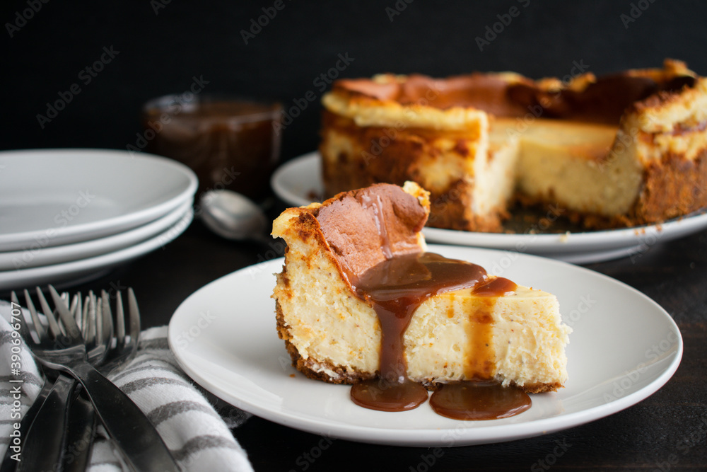 Slice of Eggnog Cheesecake with Rum Caramel Topping: A slice of cheesecake drizzled with caramel sauce