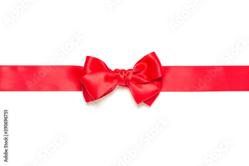 Red gift bow and horizontally crossed red ribbon isolated on white background.