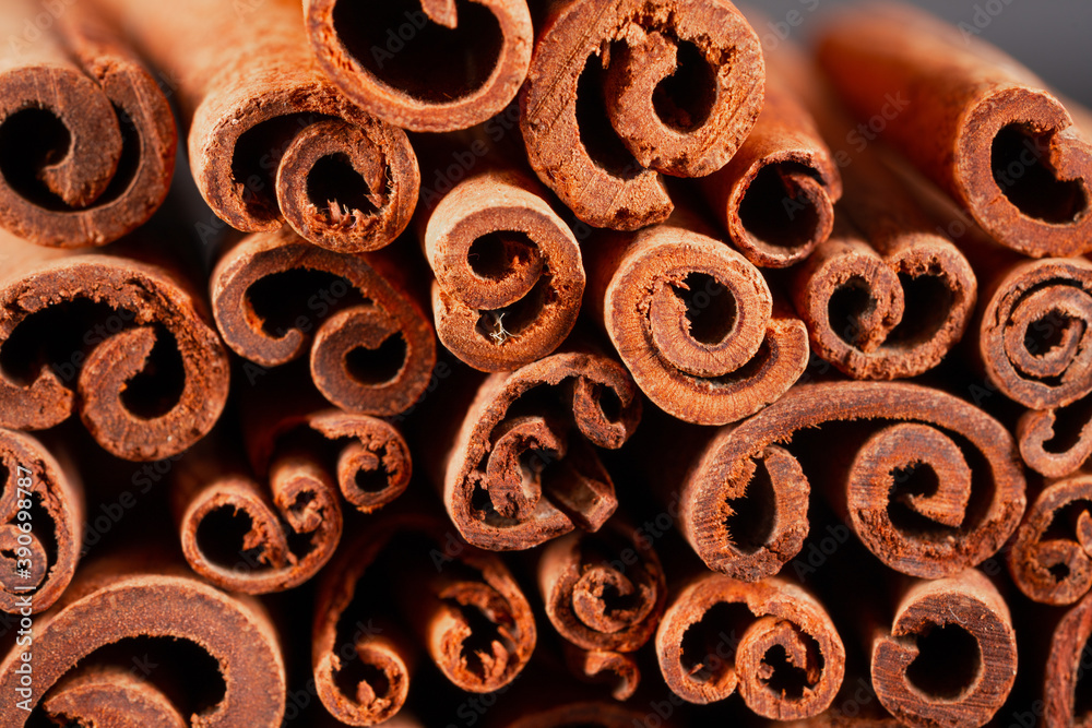 Fototapeta premium Cinnamon sticks on black background