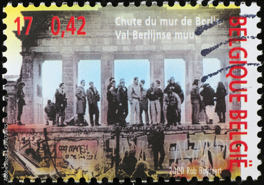 Foto de Fall of the Berlin Wall celebrated on stamp do Stock | Adobe Stock
