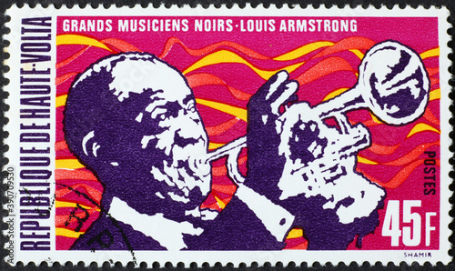Louis Armstrong playing trumpet on postage stamp photo