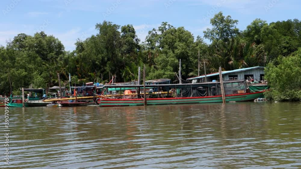 The ships are anchored on the coast. The ferry and fishing vessels at port on river canal, Thailand. The ships are anchored on the coast. The ferry and fishing vessels at port on river canal, Thailand.