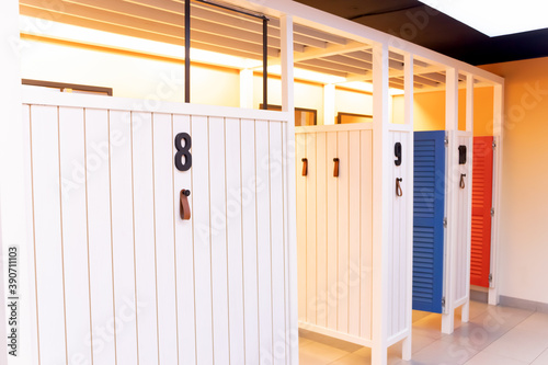 Wooden dressing rooms 8 to 10 for trying on clothes from the store. Clean, bright, comfortable and empty fitting rooms
