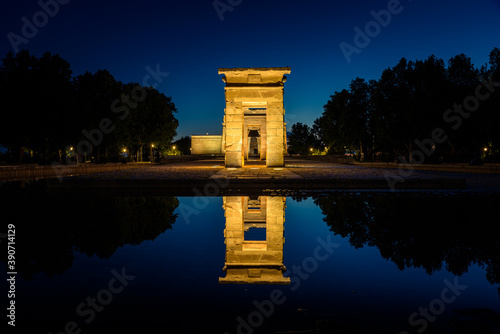 The Egyptian Temple of Debod reflected in the water of the lake at night, Madrid, Spain