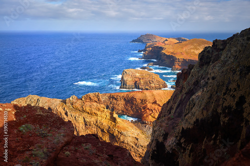 View of the Ponta de São Lourenço lighthouse. Dramatic cliffs, blue ocean, cloudy sky. hiking on Ponta de São Lourenço, Madeira Island.