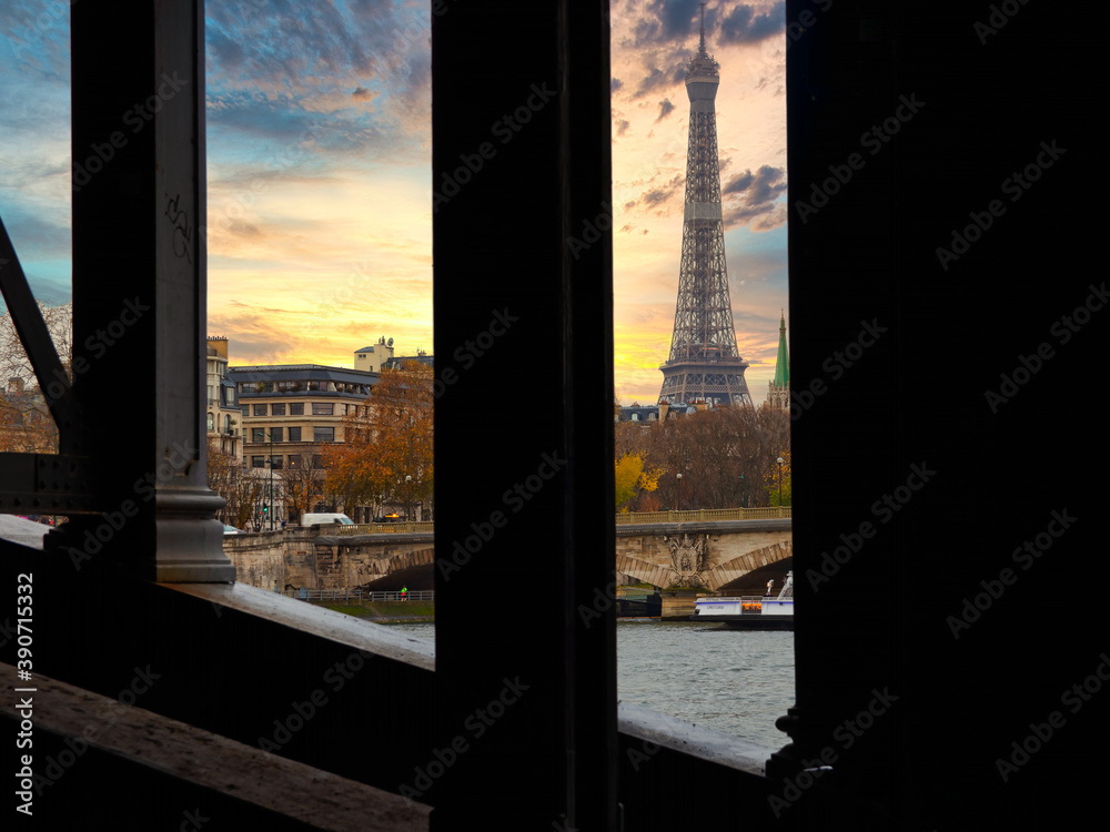 Paris, France - November 29, 2019 - Under a bridge the view of the Eiffel Tower