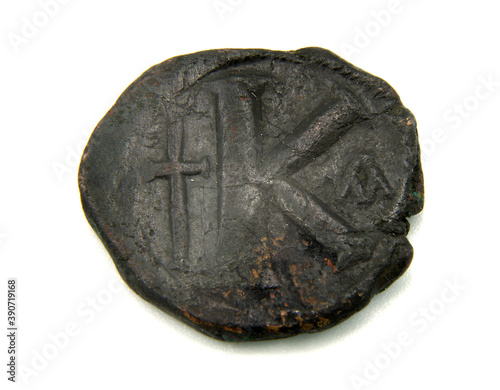 Antique copper coin of Byzantium on a white background