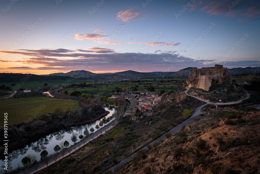 Beautiful city landscape of Zorita del los Canes with the village, Castle and Tagus river at sunset, Spain