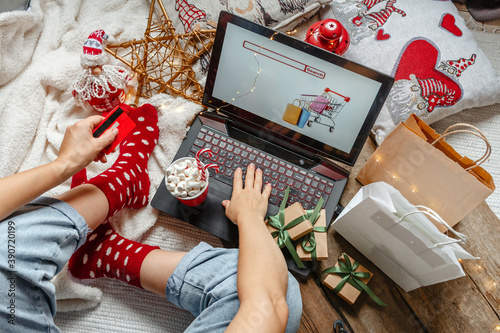 Christmas holidays, online shopping at home and lockdown coronavirus.Christmas online shopping, black friday sale and discounts promotions during the Xmas.