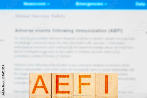 aefi. wooden cubes with the inscription aefi. concept of complications after vaccination