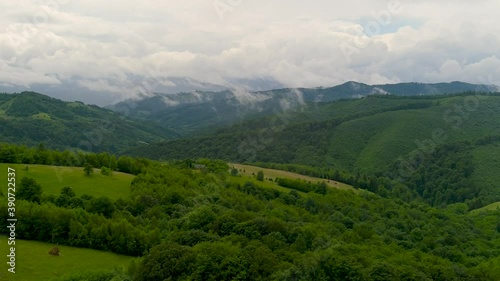 Wallpaper Mural Aerial drone footage over Transylvanian village in Romanian Carpathian mountains , Romania landscape  Torontodigital.ca
