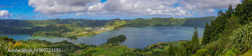 Panorama landscape with clouds and blue sky from the volcanic crater lake of Sete Citades in Sao Miguel Island of Azores Portugal photo