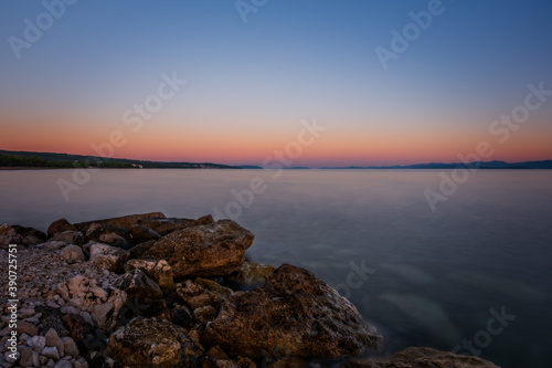 Croatia, Brac island, beach Supetrus at sunrise near Supetar. August 2020. Long exposure picture.