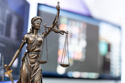 law symbol justice figure on wood table