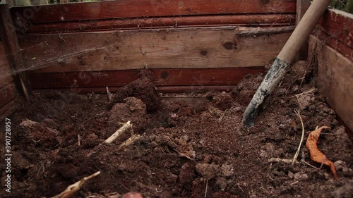 Wallpaper Mural A shovel close-up digs humus in a wooden box. Preparations are underway for planting seedlings. Seasonal work in the country. Smooth camera movement. Warm summer day. Soft light. 4K. Torontodigital.ca