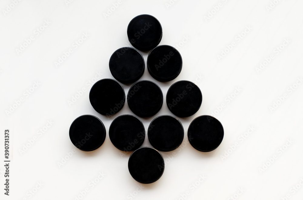 Christmas tree made from hockey puck . Top view. Christmas and New Year Holidays concept. Hockey Christmas tree Christmas tree made from hockey puck . Top view. Christmas and New Year Holidays concept. Hockey Christmas tree