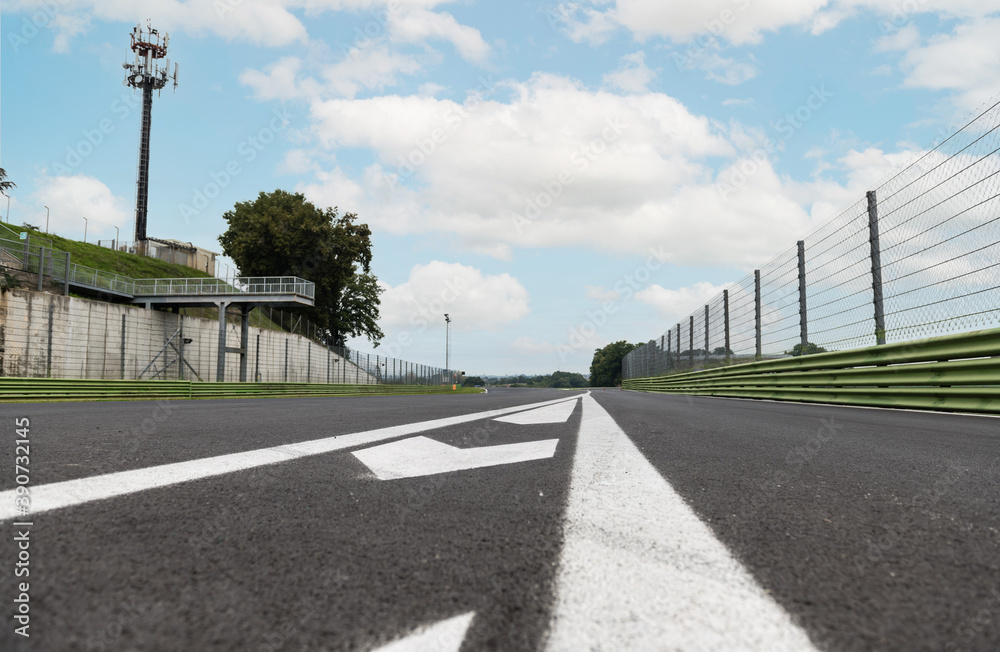 Naklejka premium Motorsport circuit pit lane exit sign on asphalt track