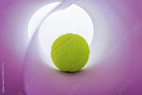 Big teniss ball on a pink background. photo
