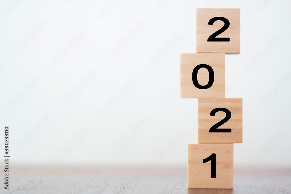 New year 2021 on wooden cubes on table with copy space for text New year 2021 on wooden cubes on table with copy space for text