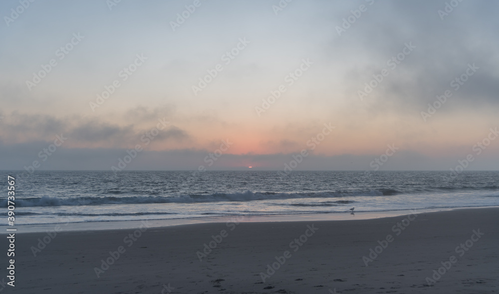 Beautiful foggy Zuma Beach sunset, Malibu, Southern California 