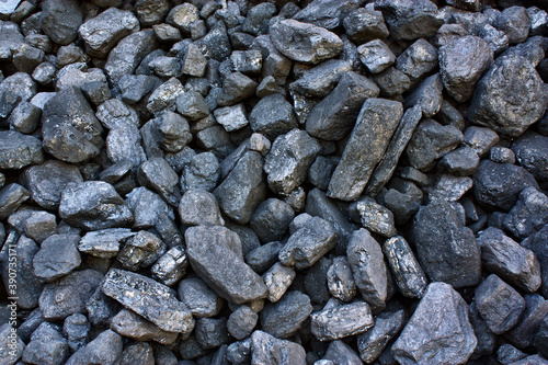 Pile of coal from mine deposit of black mineral stones
