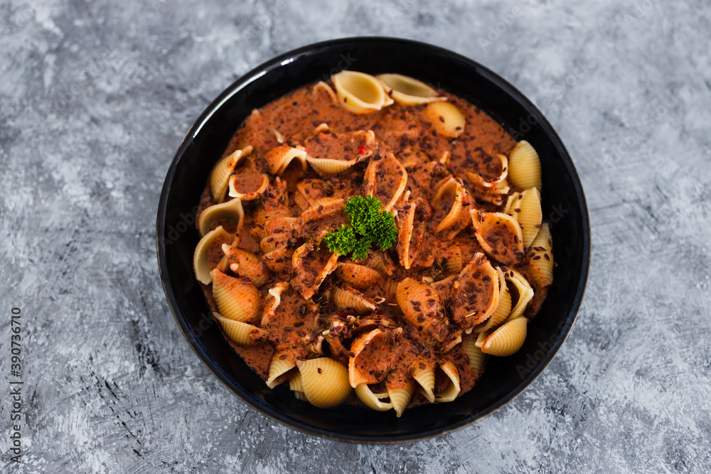 plant-based food, vegan red pesto shell pasta dish plant-based food, vegan red pesto shell pasta dish